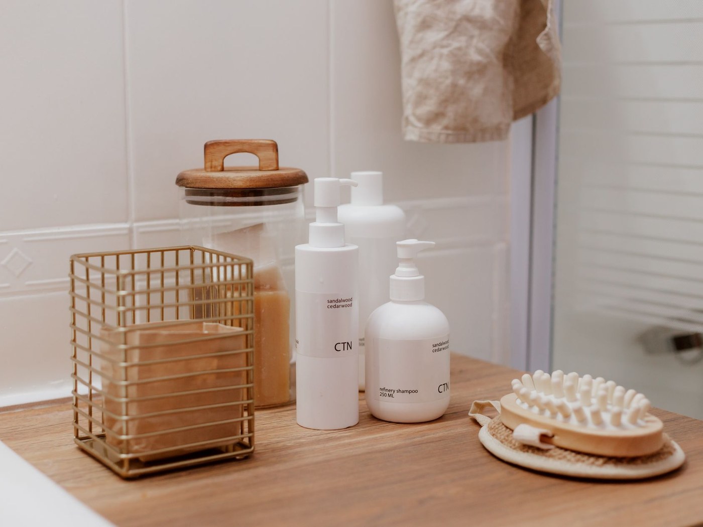 Morning bathroom shelf with self-tan stored separately from moisturiser and sunscreen